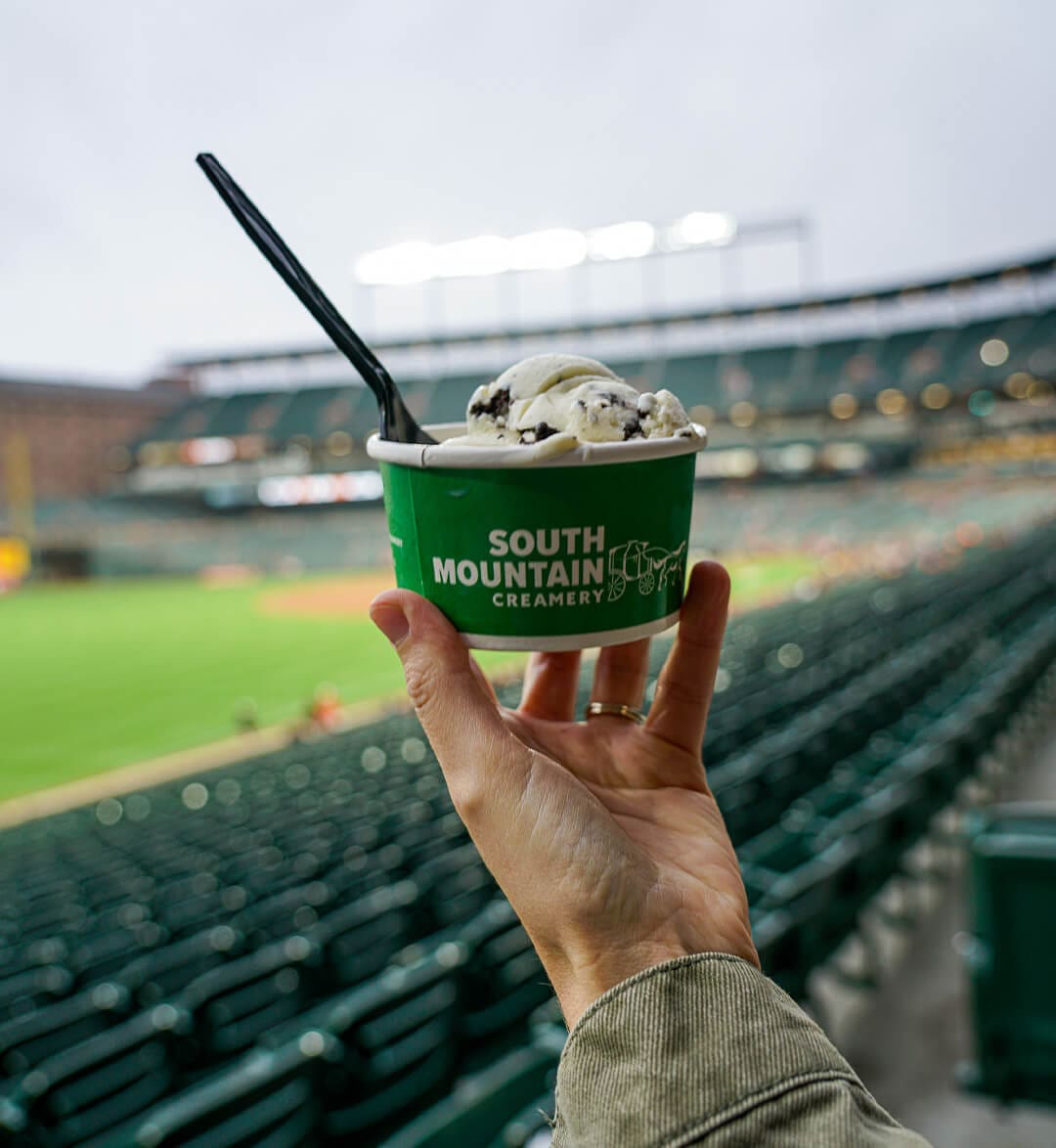 Girl handing ice cream in a cone at Karen's Kountry Store