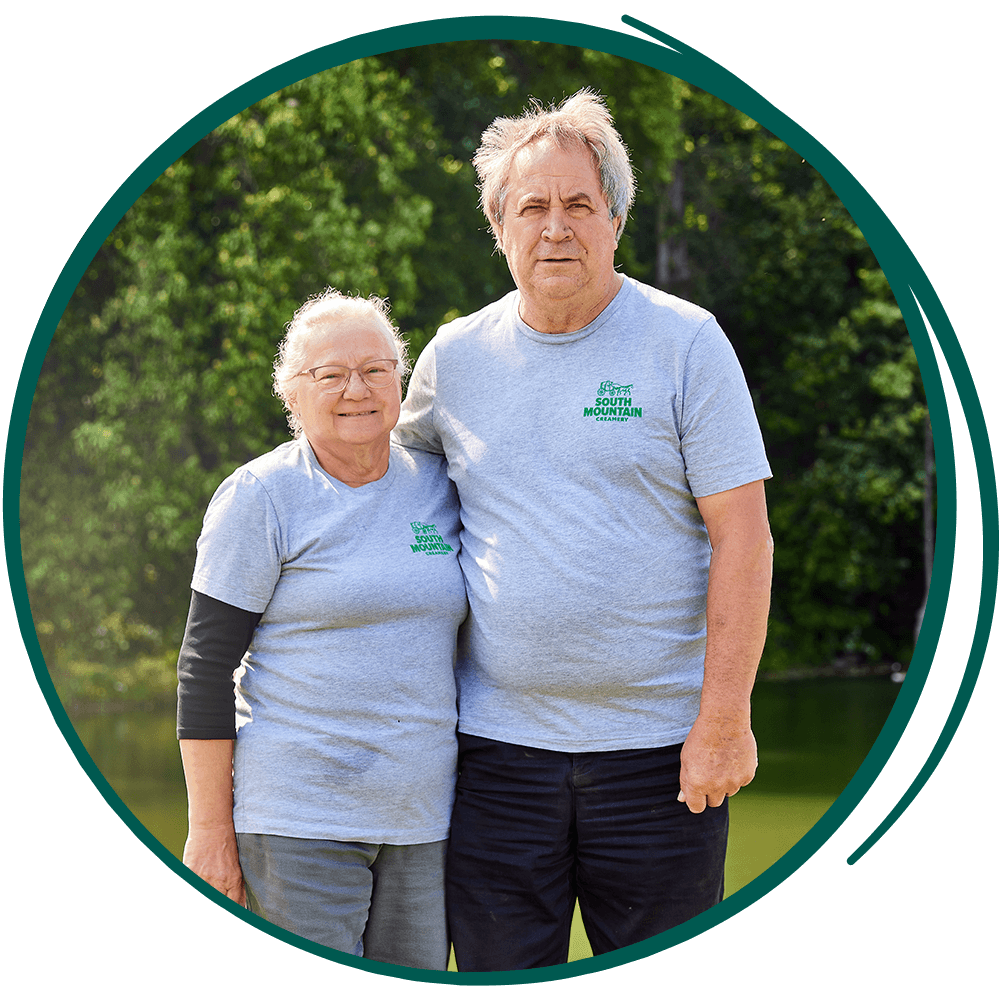 A couple standing in field